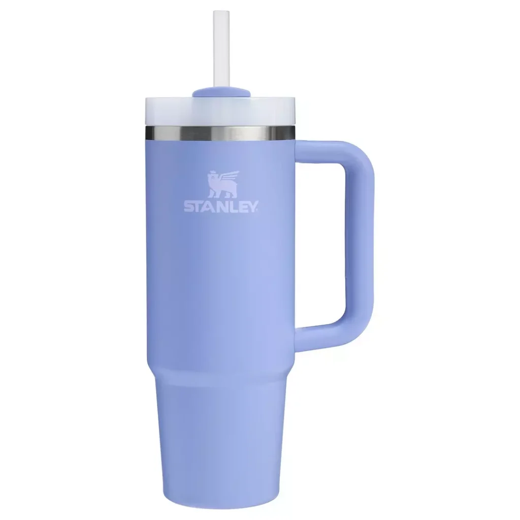 bright blue Stanley bottle with a slightly transparent straw lid, a large carry handle at the side and a lighter blue Stanley logo