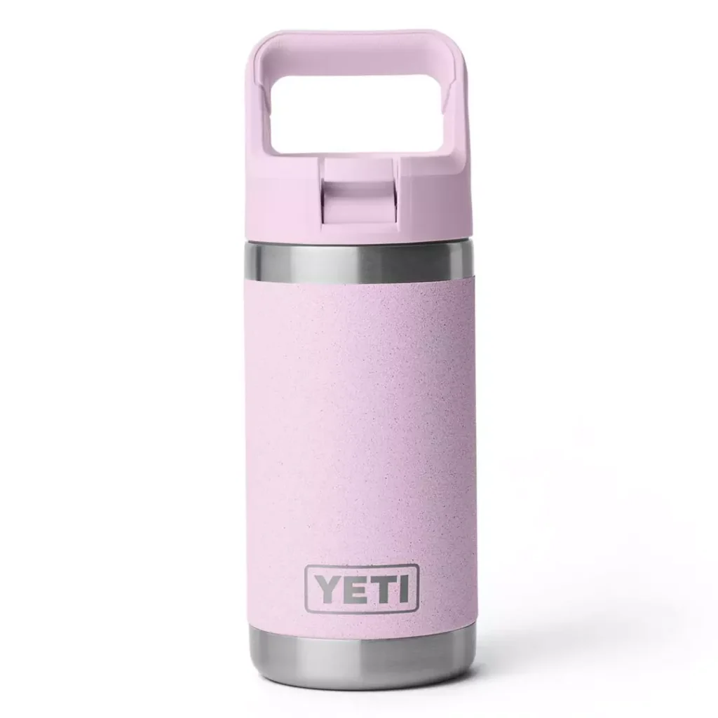 light pastel pink/purple YETI bottle with contrast dark silver metallic trim, a tonal pastel pink/purple lid with a looped carry handle and contrast block YETI branding towards the bottom