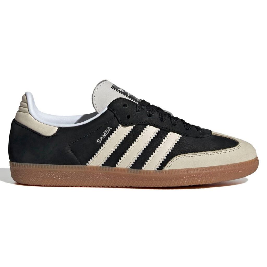 black adidas Samba sneaker with contrast tan/off-white serrated 3-Stripes at the sides, contrast tan/off-white t-toe and back heel panel and tongue; contrast brown gum rubber outsole, black traditional laces